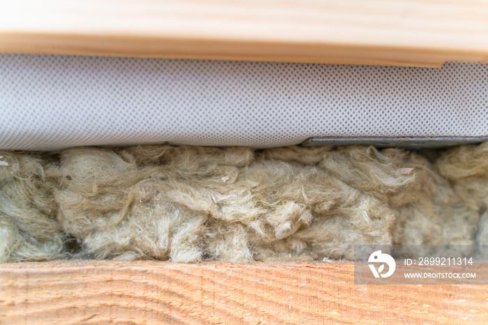 Roof insulation with mineral wool, close-up. Mineral wool between the skin and the hydro-barrier