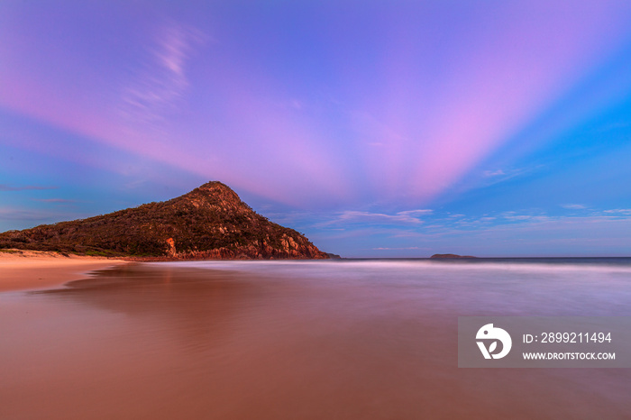 Colourful evening light over Zenith Beach. Tomaree Headland, in the distance. Port Stephens ,Hunter Region of N.S.W. Australia.