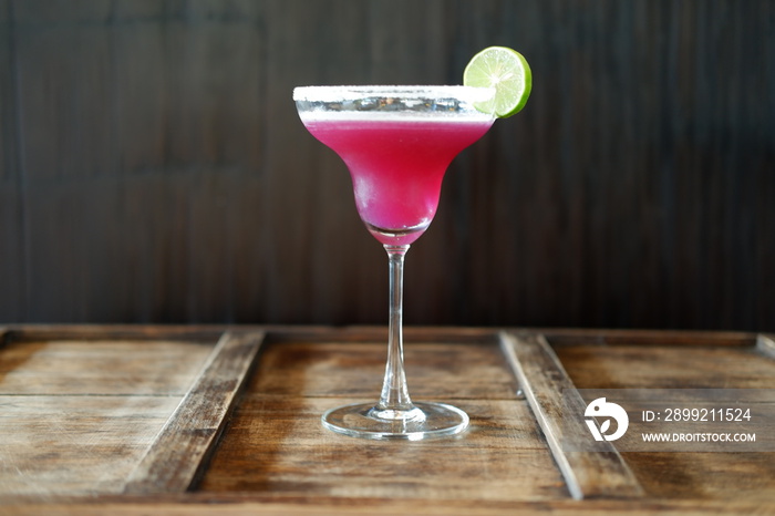 pink margarita cocktail on wooden table