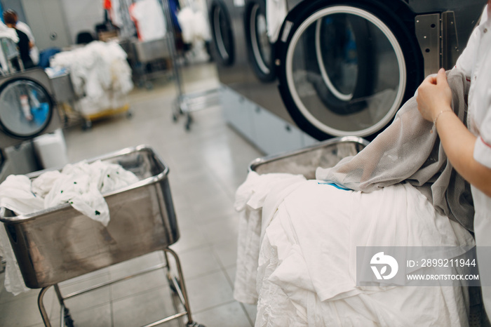 Dry cleaning clothes. Clean cloth chemical process. Laundry industrial dry-cleaning