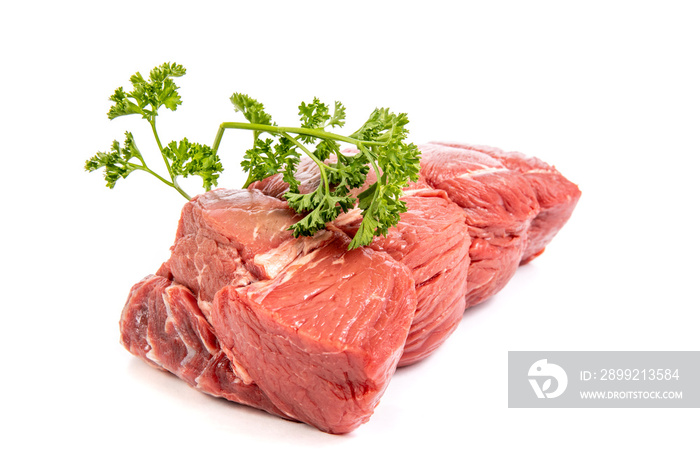 A cut of beef sirloin tip roast with parsley garnish isolated on white