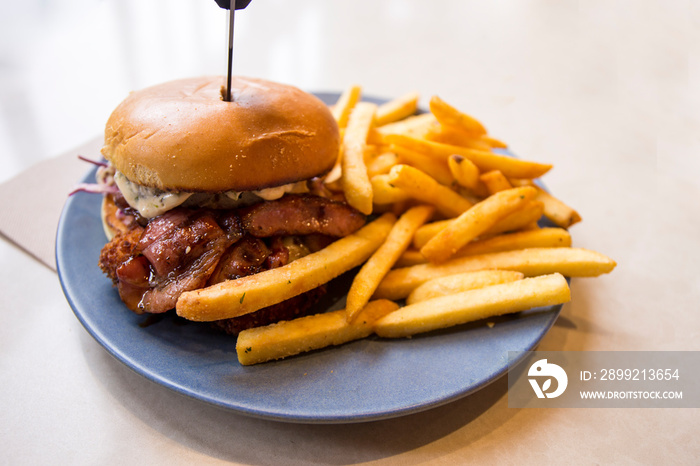 chicken schnitzel burger, bacon with chips