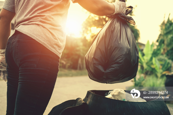 woman hand holding garbage bag for recycle cleaning