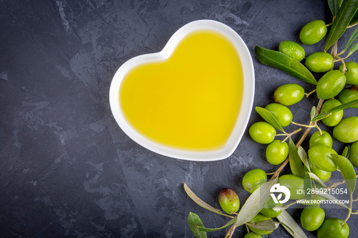 Green fresh olives and olive oil