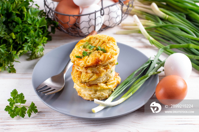 Egg bite food pastry with vegetables and herbs on the plate