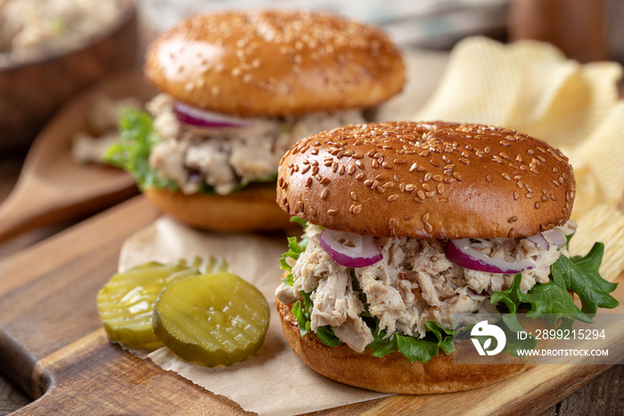 Tuna salad and lettuce sandwich on sesame seed bun