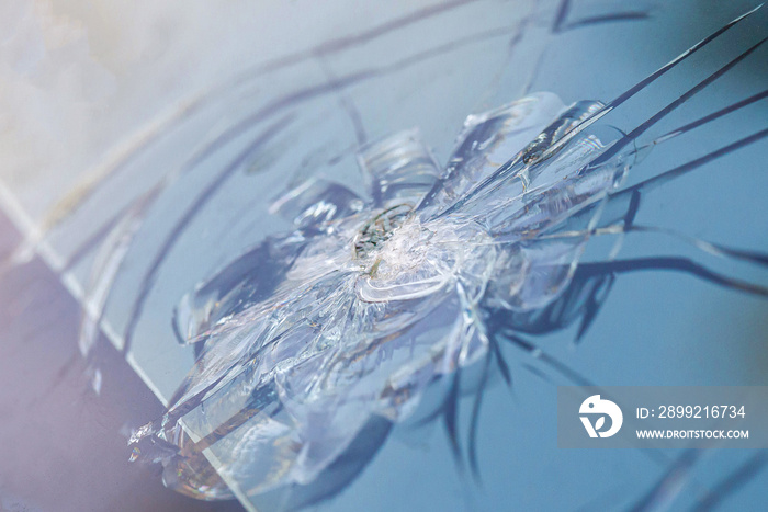 Smashed windscreen of a car, damaged glass