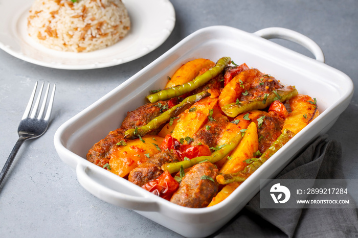 Traditional Homemade Turkish Food Kofte - Kofta with Tomato Sauce and Potatoes. (Turkish name; Izmir kofte)