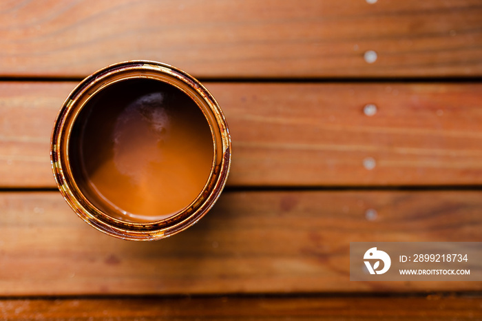 open pot of decking stain on top of outdoor wooden stairs, home improvement and outdoor living