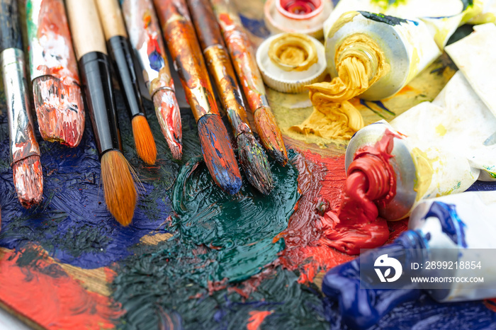 Paint brushes and paints for drawing.