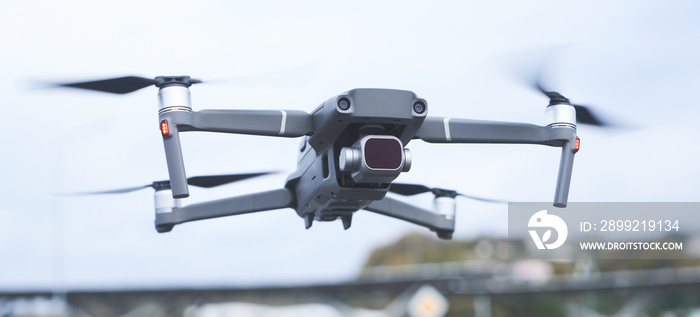 Quadcopter in the sky shoots a video of the urban landscape close-up