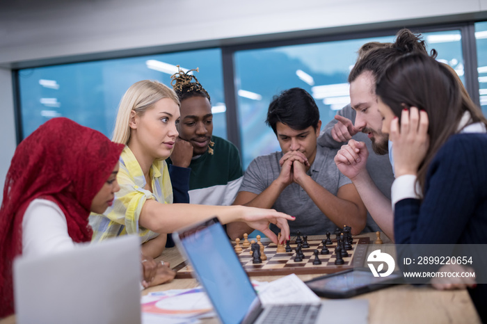 multiethnic group of business people playing chess