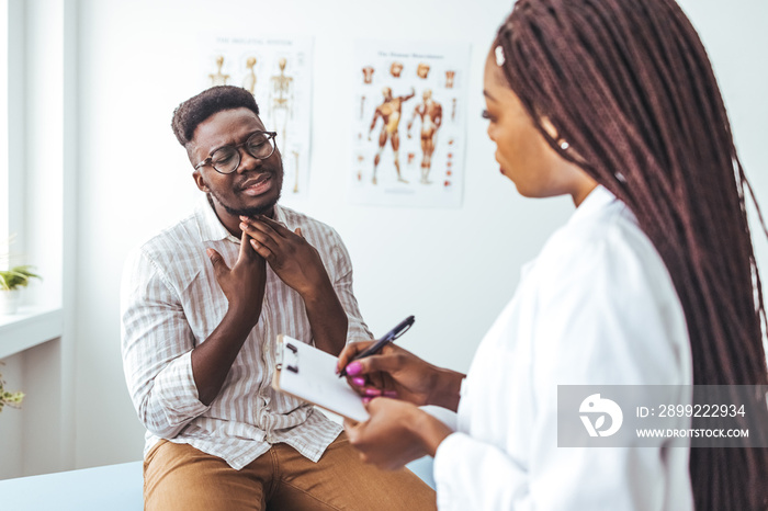 African american mid adult man with eyes closed touching painful throat against white background. copy space, throat, thyroid, medical, pain, sickness and healthcare concept.