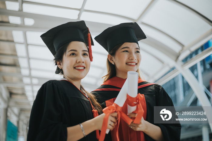 Happy student graduate hand holding diplomas and gold prize coins.