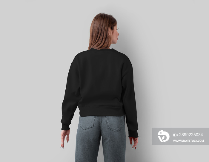 Mockup of a fashion black cropped shirt on a slim girl, stylish clothes canvas bella, isolated on white background, back view.