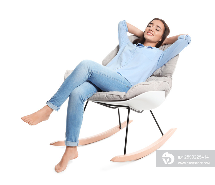 Young woman resting in rocking chair on white background