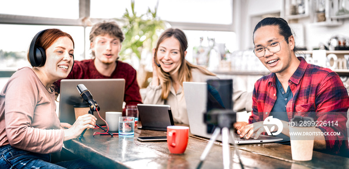 Happy students sharing content on streaming platforms with digital web cam - Modern life style concept with guys and girls speaking and having fun vlogging live feeds on social media - Bright filter