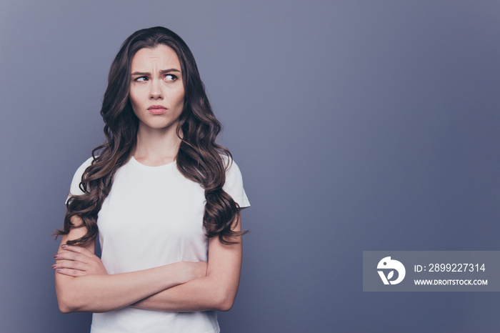 Adorable attractive nice charming gorgeous curly-haired brunette caucasian thoughtful young girl with folded hands. Copy space. Isolated over grey background