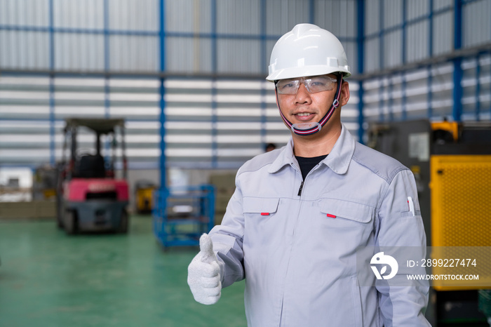 Portrait of manual asian man worker is standing show confidence with confident with working suite dress and safety helmet of high technology clean industry factory.