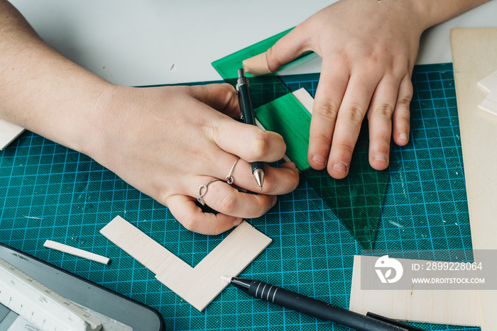 A Woman architecture student working on models