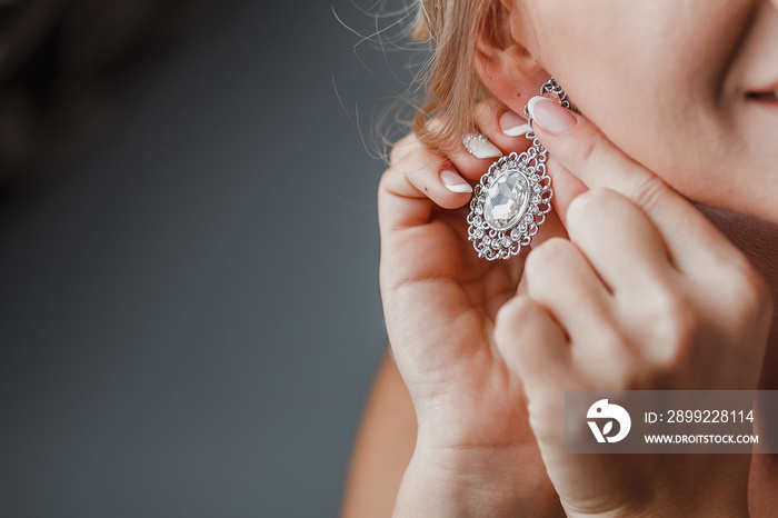 close up of beautiful woman wearing vinyage shiny diamond jewelr