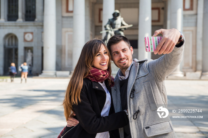 couple taking selfie at prado museum madrid