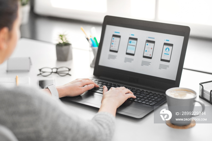 app design, technology and business concept - web designer or developer with templates on laptop computer screen working on user interface at office