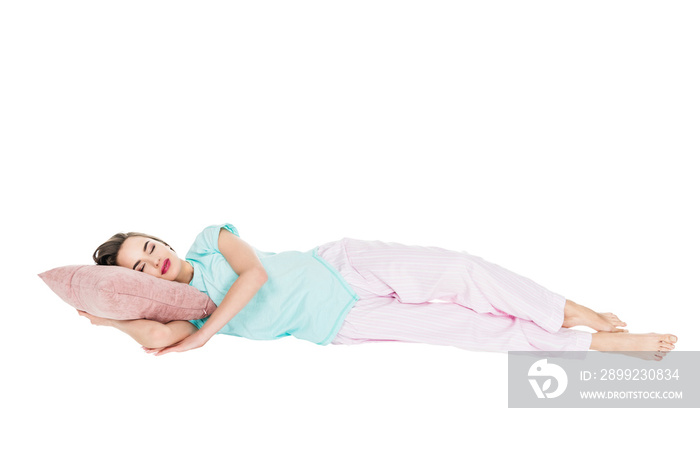 girl in pajamas sleeping on pillow isolated on white