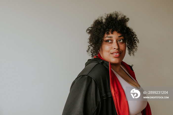 closeup of a plus size afros indigenous person looking over shoulder