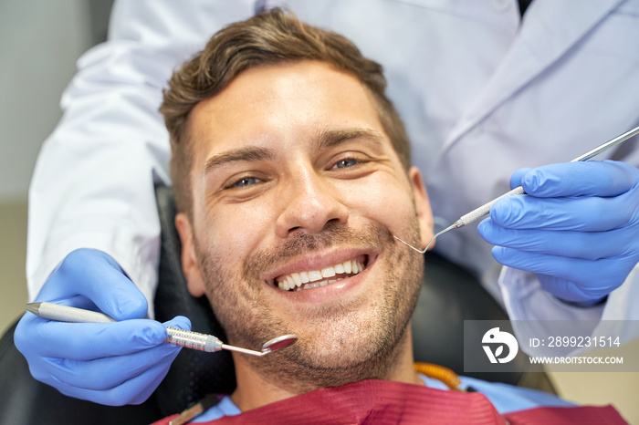 Joyous patient feeling alright at dental check-up