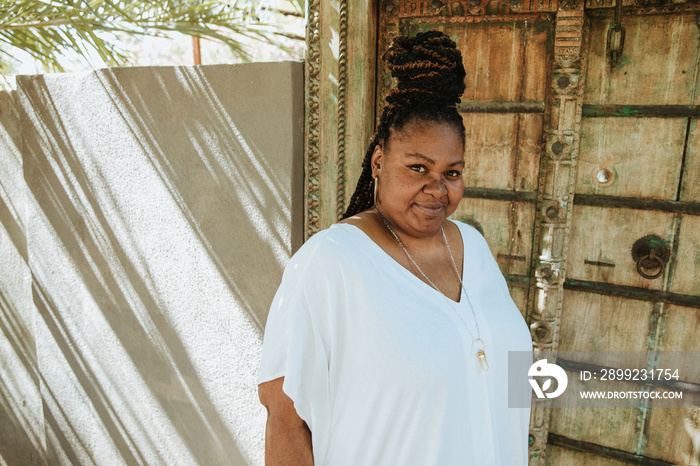 plus size African American woman standing outside a door