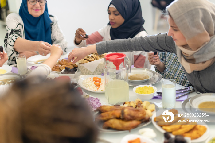 modern multiethnic muslim family having a Ramadan feast