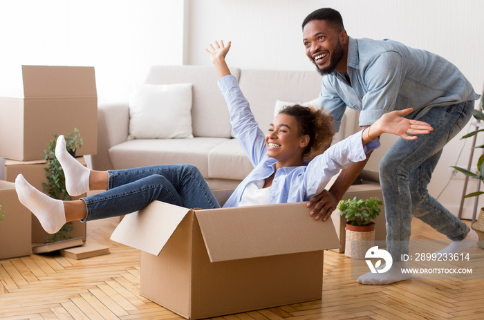 Afro Husband Riding Wife In Moving Box In New House