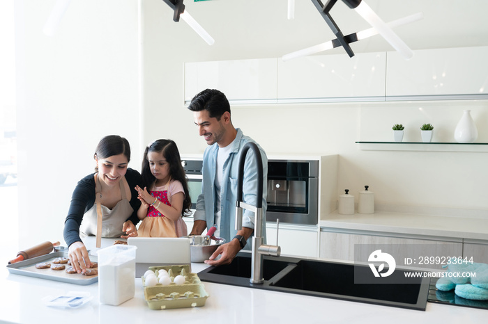 Happy Family Preparing Cookies At Home