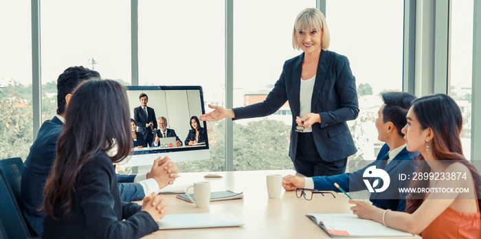 Video call group business people meeting on virtual workplace or remote office. Telework conference call using smart video technology to communicate colleague in professional corporate business.