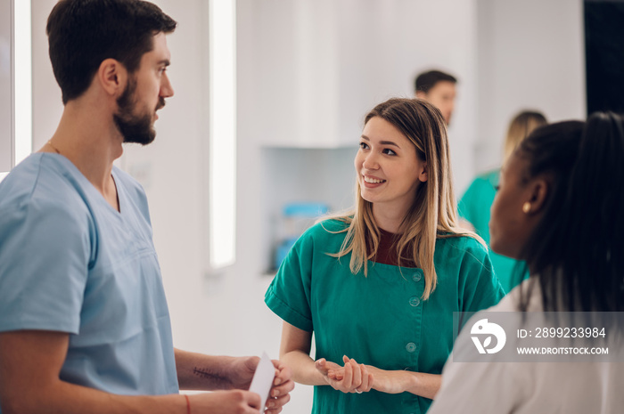 Multiracial team of doctors discussing a patients condition while working in a hospital