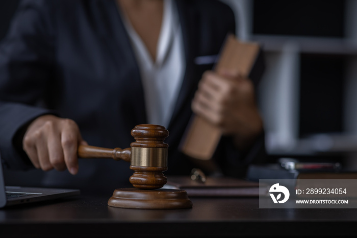 Attractive lawyer in office Business woman and lawyers discussing contract papers with brass scale on wooden desk in workplace. Law, legal services, advice, Justice and real estate concept.