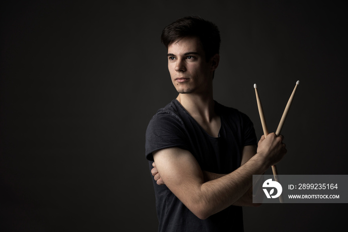 David Schwitzgebel drummer professional musician artist rock star man pose studio dark black mascular broad bold