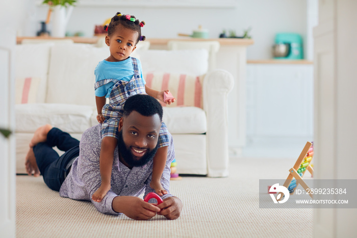 africam american family, father and daughter having fun together at home