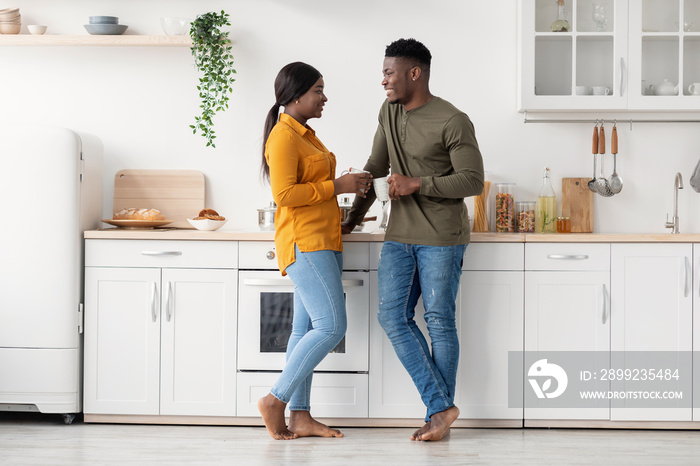 Young Black Married Couple Spending Time Together In Kitchen At Home