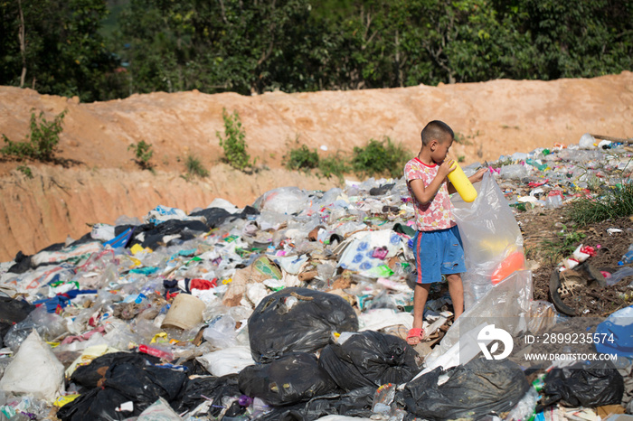 Poor children collect garbage for sale because of poverty, Junk recycle, Child labor, Poverty concept, World Environment Day,