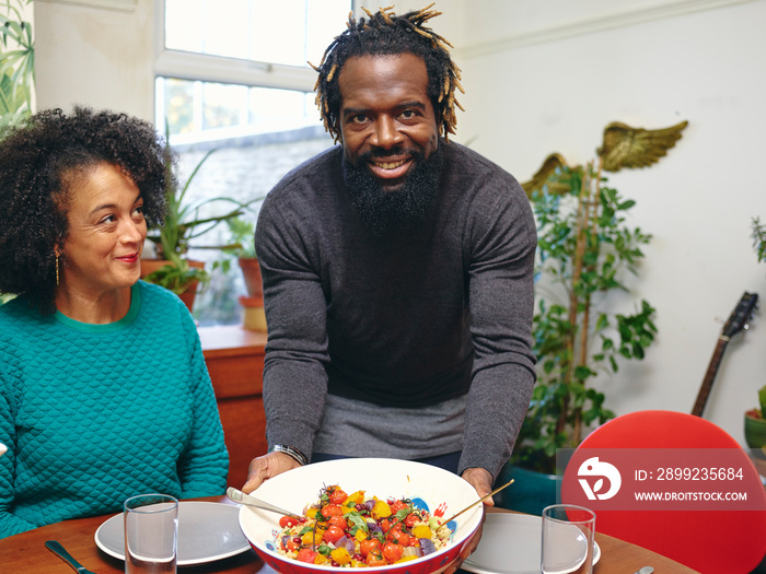 Couple preparing to eat lunch at home