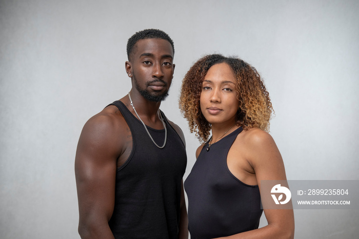 Portrait of couple wearing black tank tops