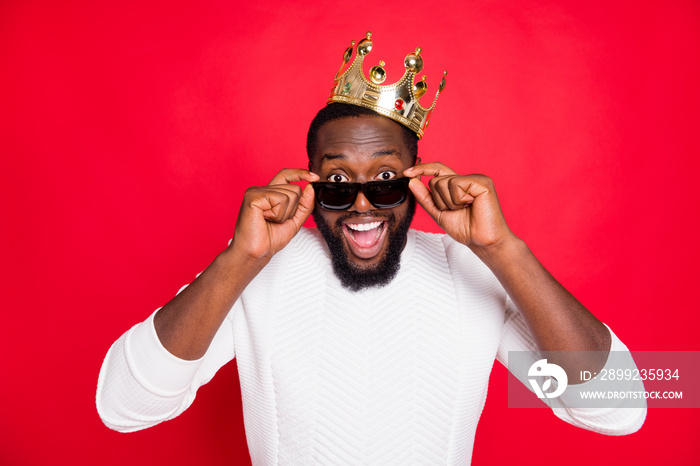 What... Prom party king. Really. Close up photo of amazed funky dark skin man hear unbelievable news scream wow omg touch specs wear white prince stylish jumper isolated over red color background