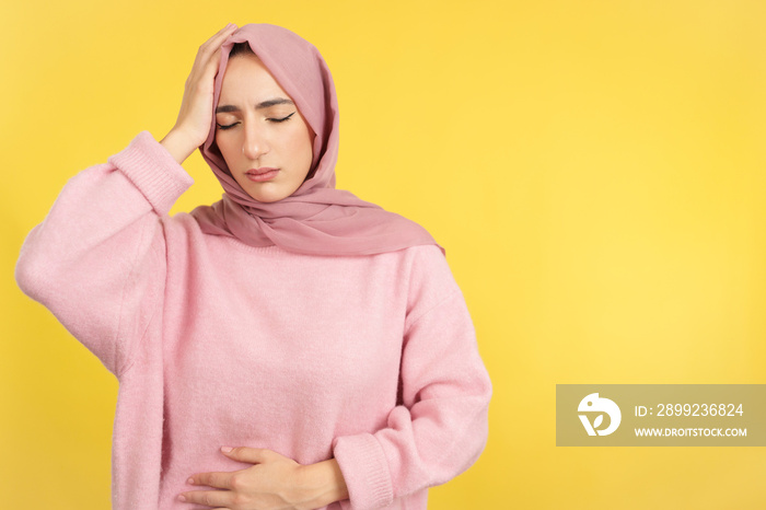 Muslim woman with scarf not feeling well