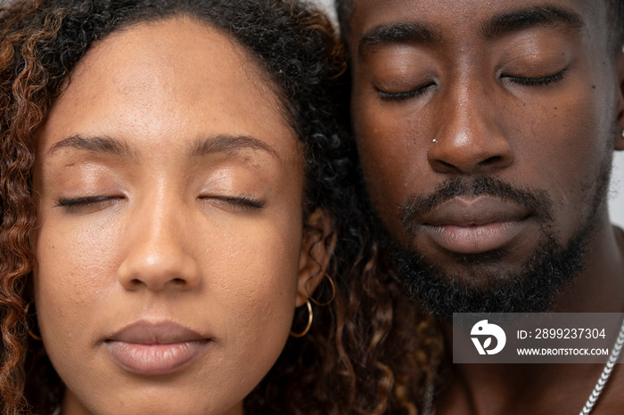 Portrait of couple with closed eyes