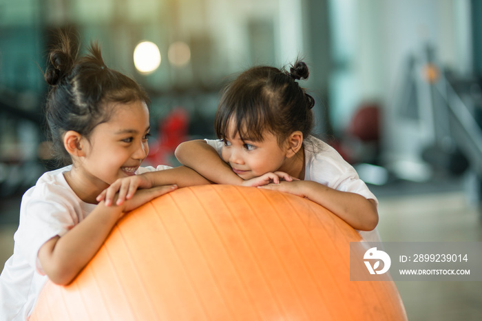 Gymnastic balls and kids on them