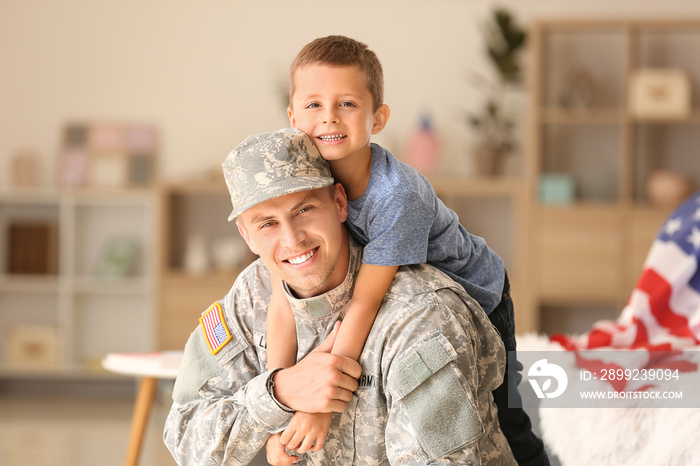 Happy military man with his son at home