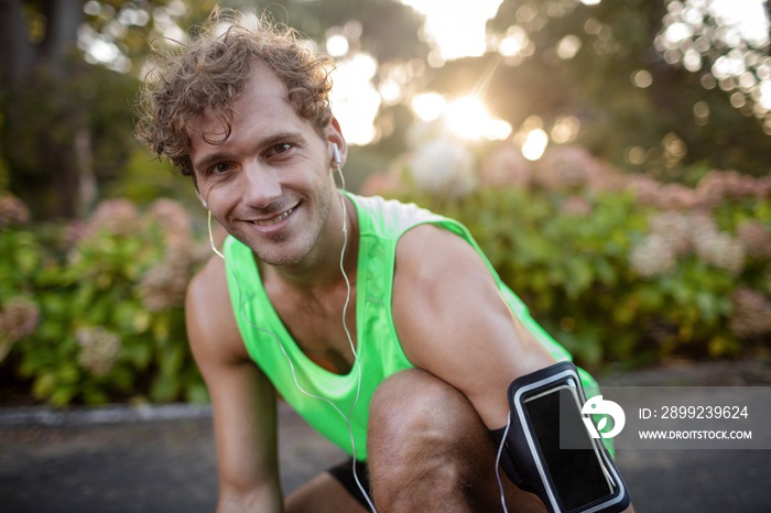 Happy man listening to music on mobile phone