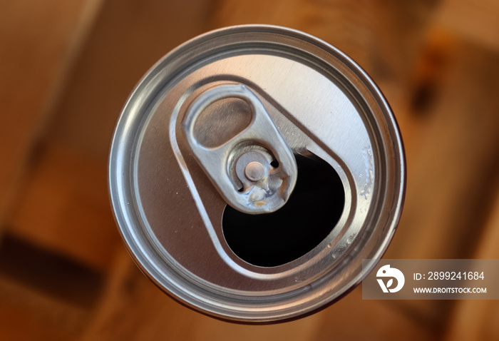 Close up top view up a can of soft drink isolated on wooden background